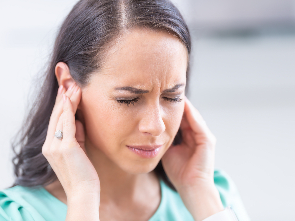 Audiologist evaluating a patient experiencing tinnitus at Autumn Oak in Friendswood, TX