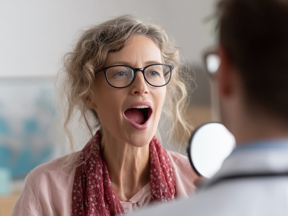 Speech-language pathologist guiding a patient through voice therapy at Autumn Oak in Friendswood, TX