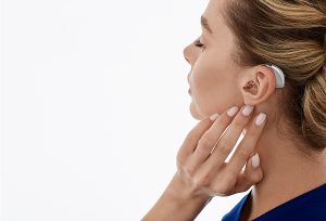 Women wearing over-the-counter hearing aids